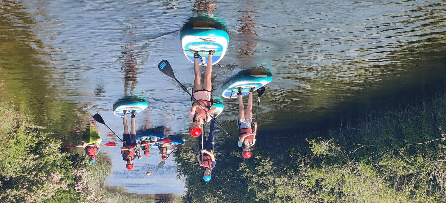 Sidcot students paddleboarding during PASS