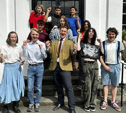 James jones and students celebrating exam results