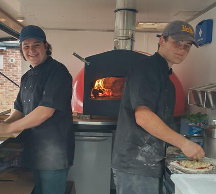 Chris and Wolfe in food truck