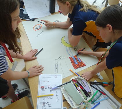 Sidcot students working in a group around a wooden table