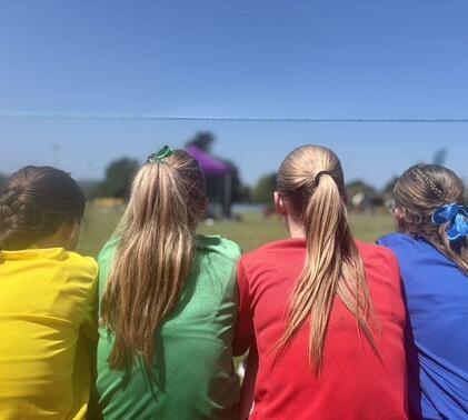 Sidcot students sat in house colours