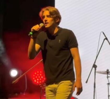 Sidcot student performing on stage as part of work experience week