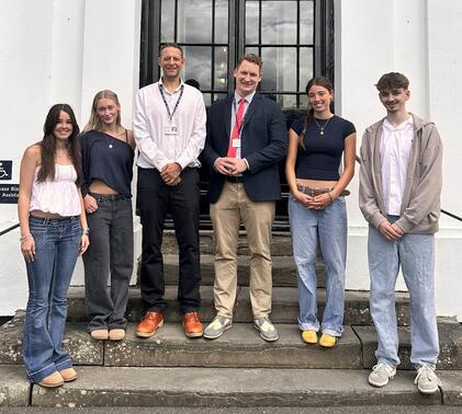 A Level students posing outside front of Sidcot School
