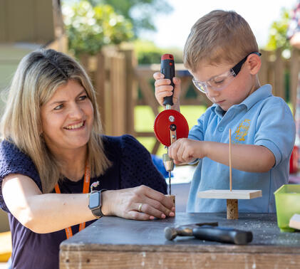 Sidcot Pre-School student using tools with teacher