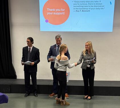 Teasel receiving her award