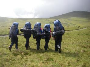 Students Climbing a Mountain