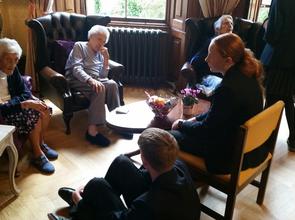 Upper Fifth students visiting the residents of Winscombe Hall