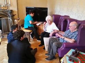 Upper Fifth students visiting the residents of Winscombe Hall