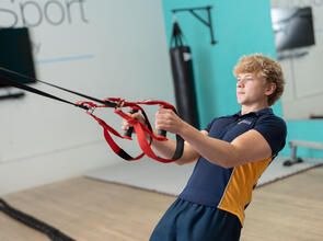 Boy using gym equipment
