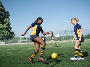 girls playing football