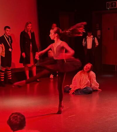 Sidcot student dancing in red light