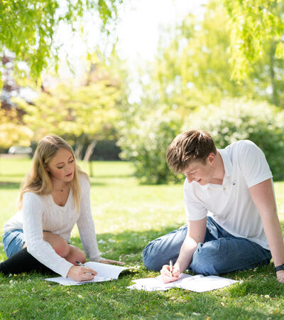 Sidcot Sixth Form students studying in the gardens