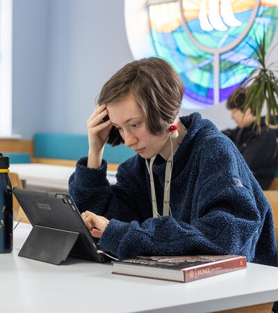 one student studying in the library