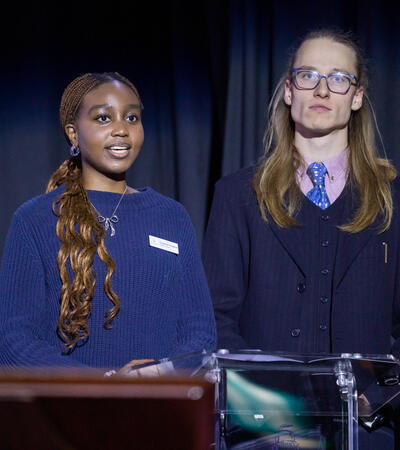 Sidcot head students presenting in front of the school