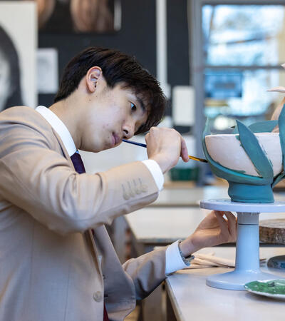 Sidcot Sixth Form student painting ceramics