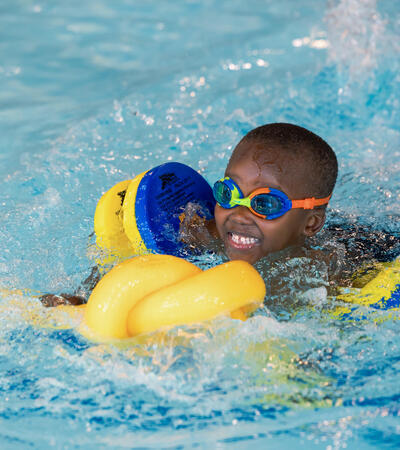 Sidcot early years pupil swimming in on-site pool