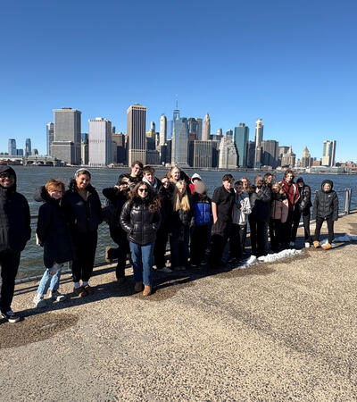 Sidcot trip to New York. Students posing in front of skyline.
