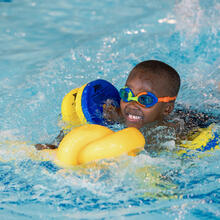 Sidcot early years pupil swimming in pool