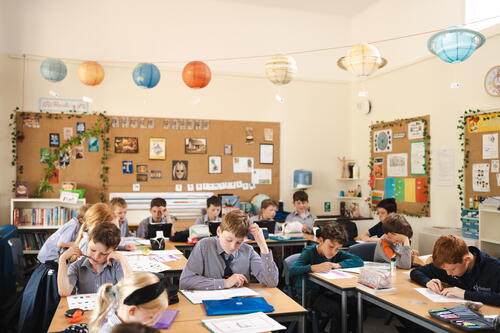 children in a school discussing SATs and mental health