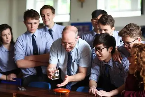 Senior students conducting a science experiment with teacher at our prviate boarding school near Bristol, students from Bath and the wider Somerset areas.